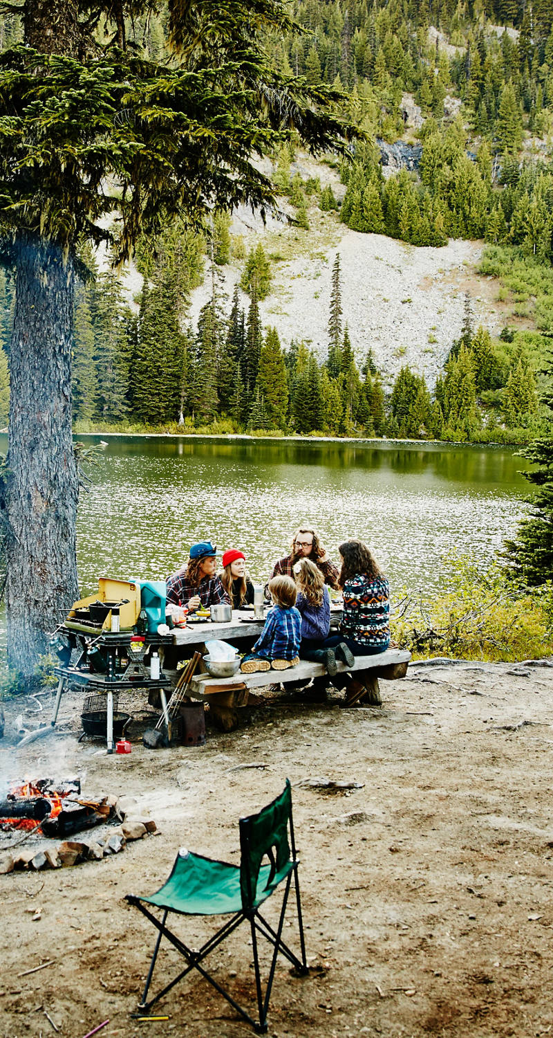 A family camping wild in a forest with lake