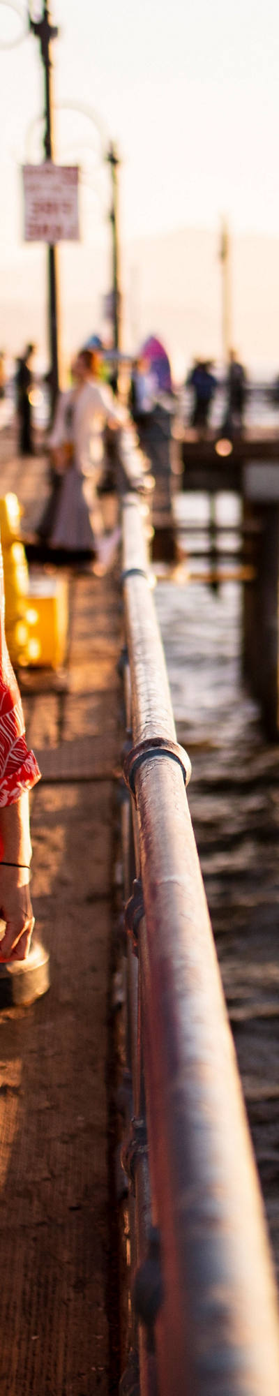 Woman strolling along the pier.