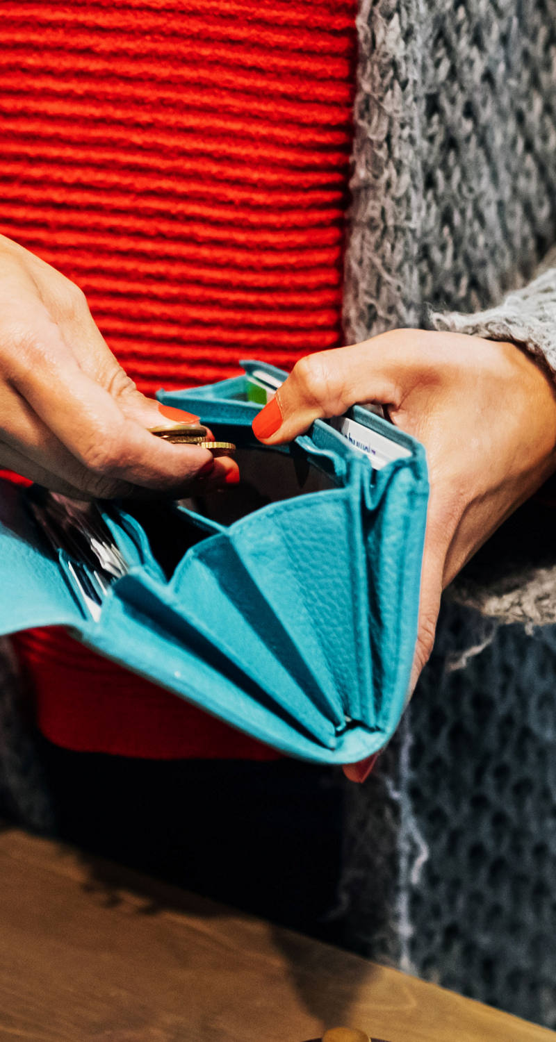 Woman pays with money from wallet