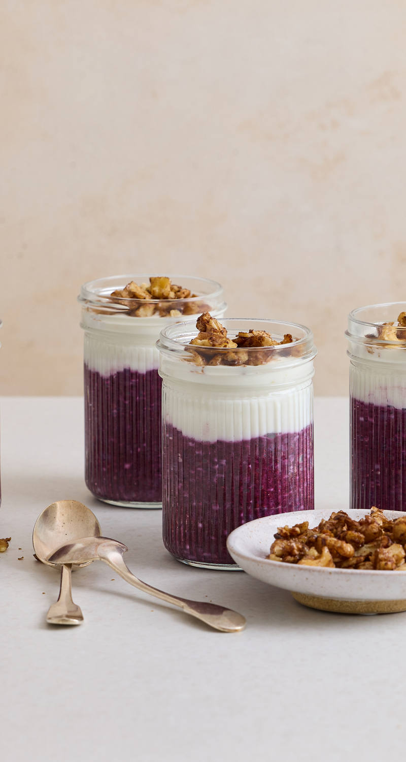 Bilberry and chia pudding served in preserving jars.