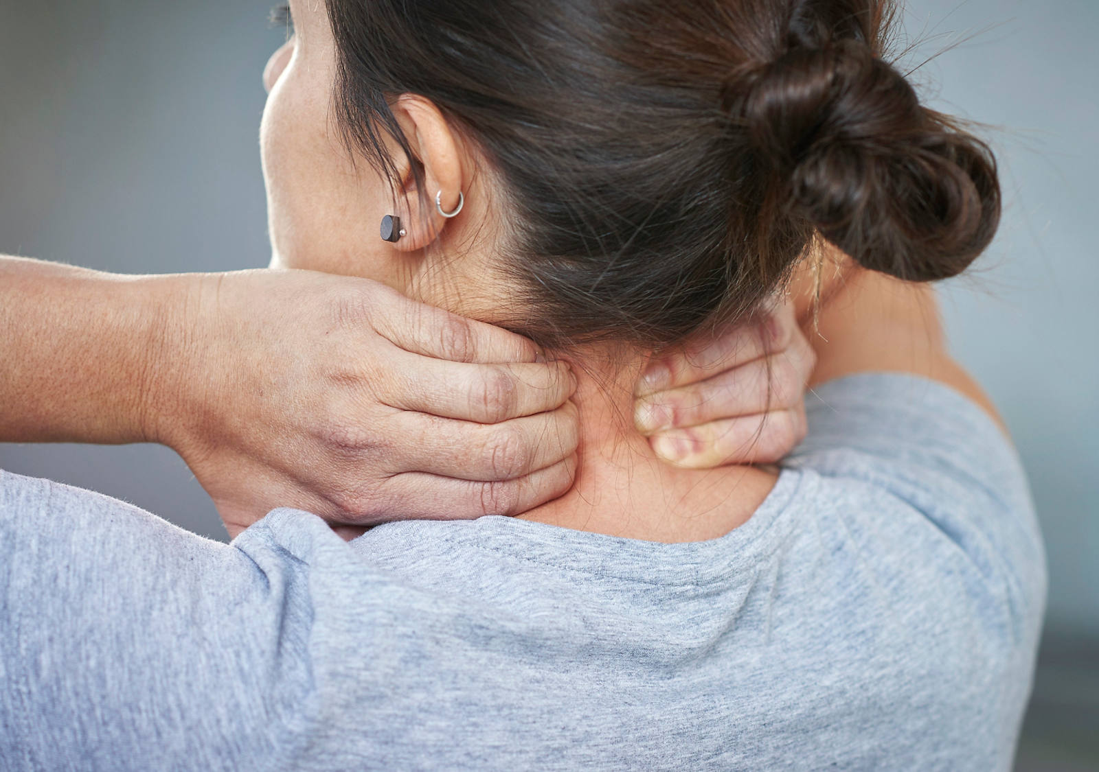 Neck massage: Grasp the muscle with both hands to the right and left of the spine