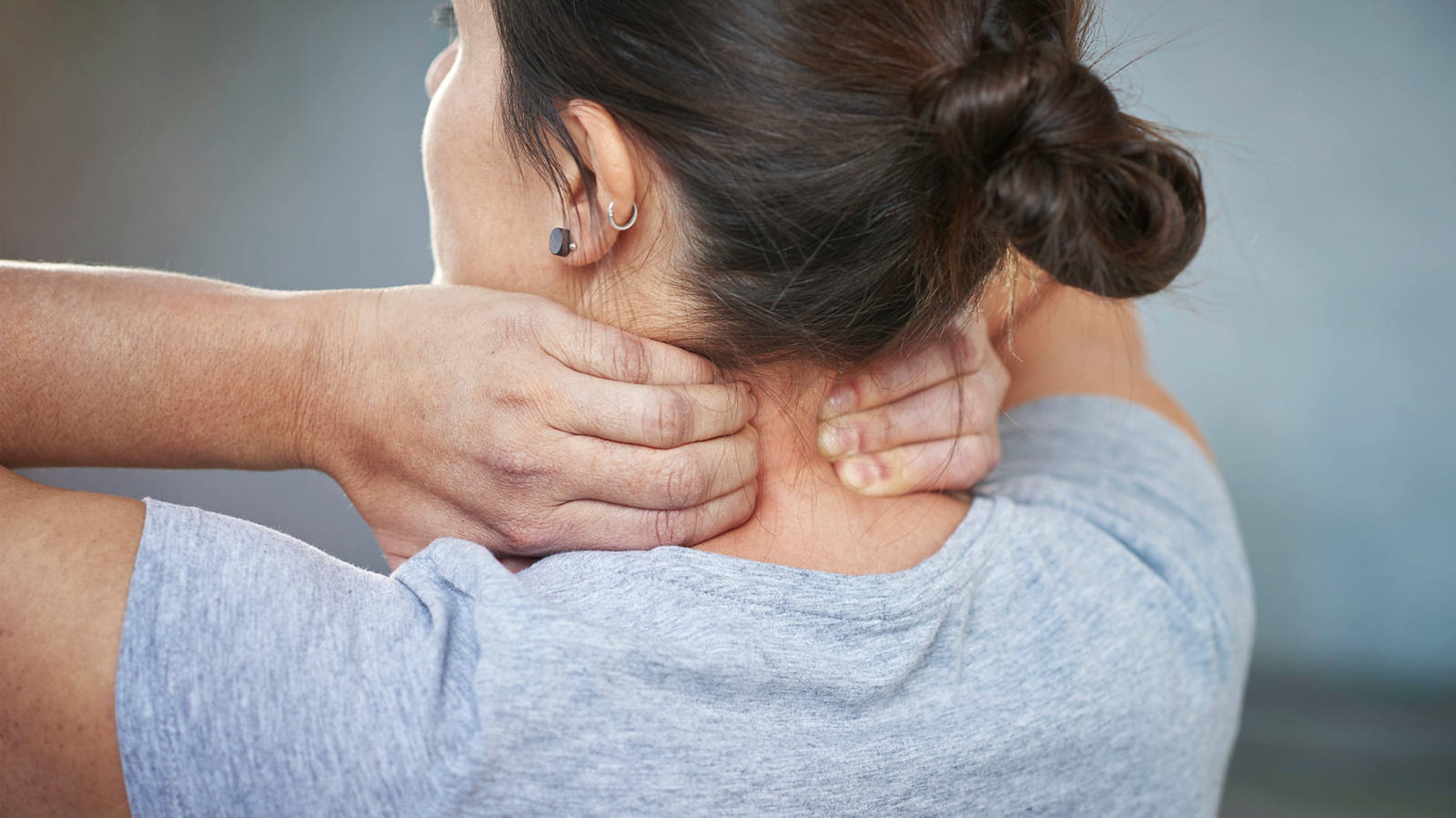 Neck massage: Grasp the muscle with both hands to the right and left of the spine