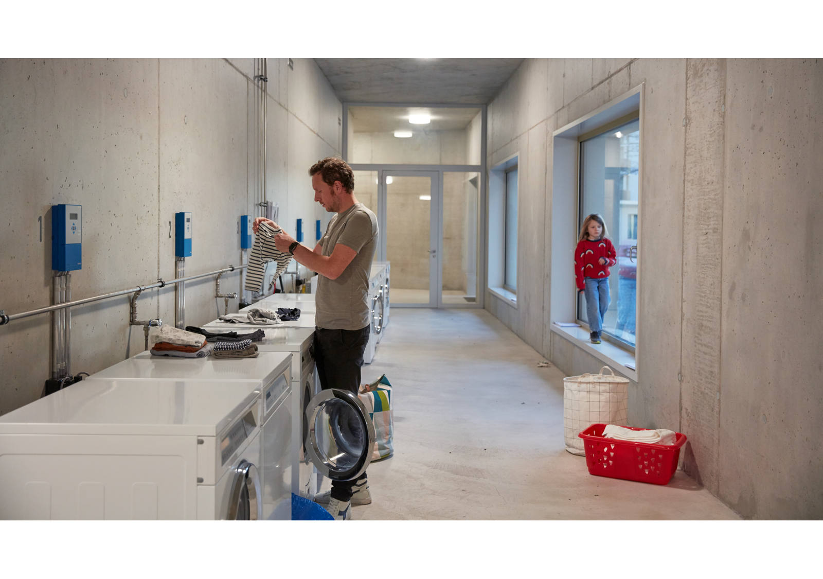 Man washing laundry in a laundry room