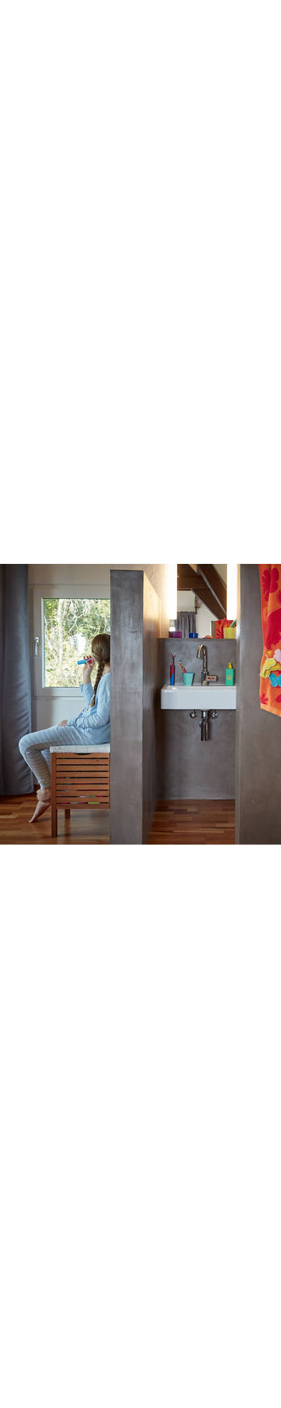 Girl brushing teeth in bathroom